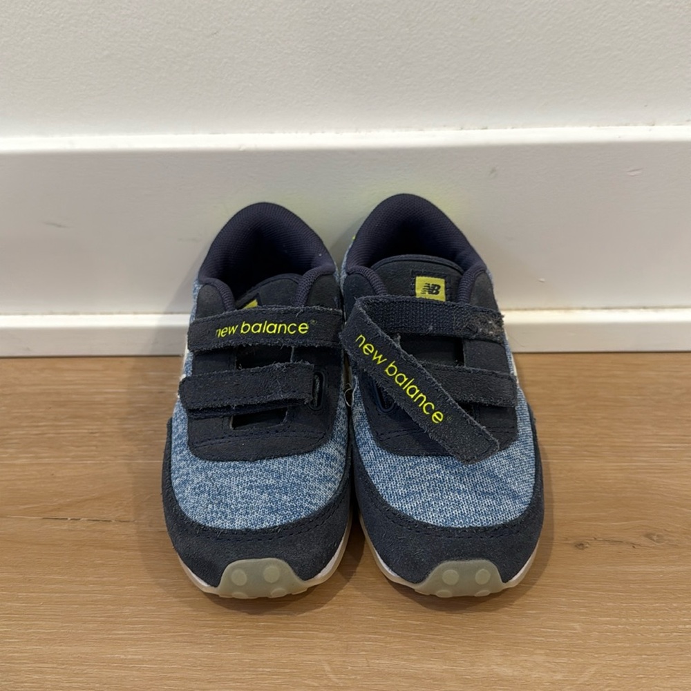 Kids new balance shoes slightly worn, still very good condition.